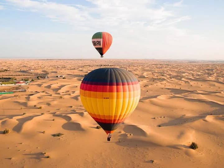 people enjoying hot air balloon ride over Dubai