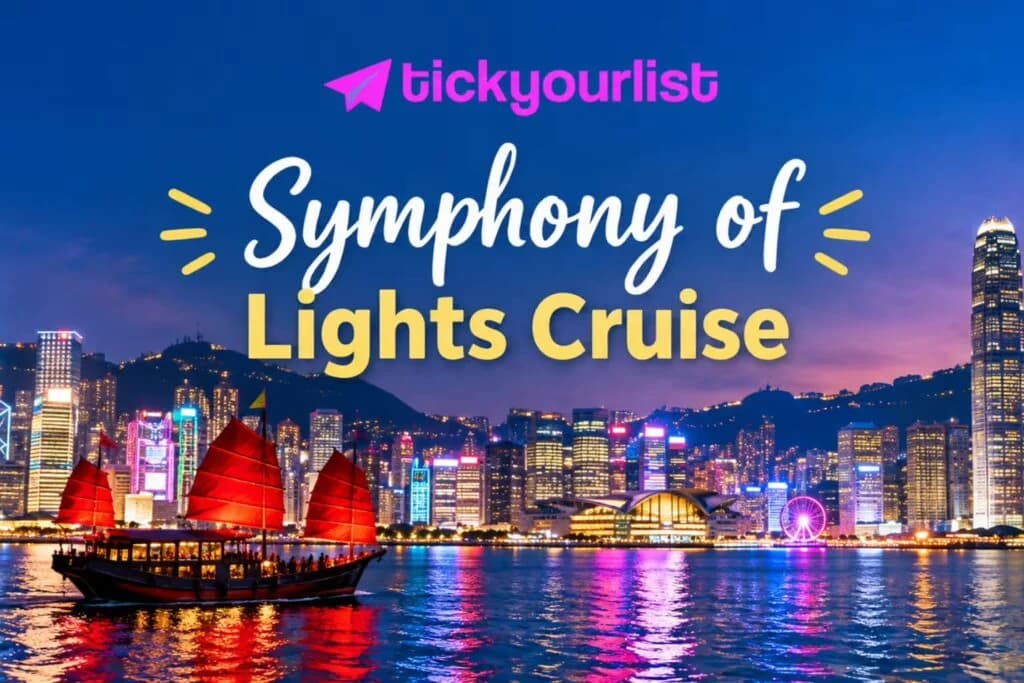 Hong Kong skyline glowing over Victoria Harbour at night with a traditional red-sailed junk boat.