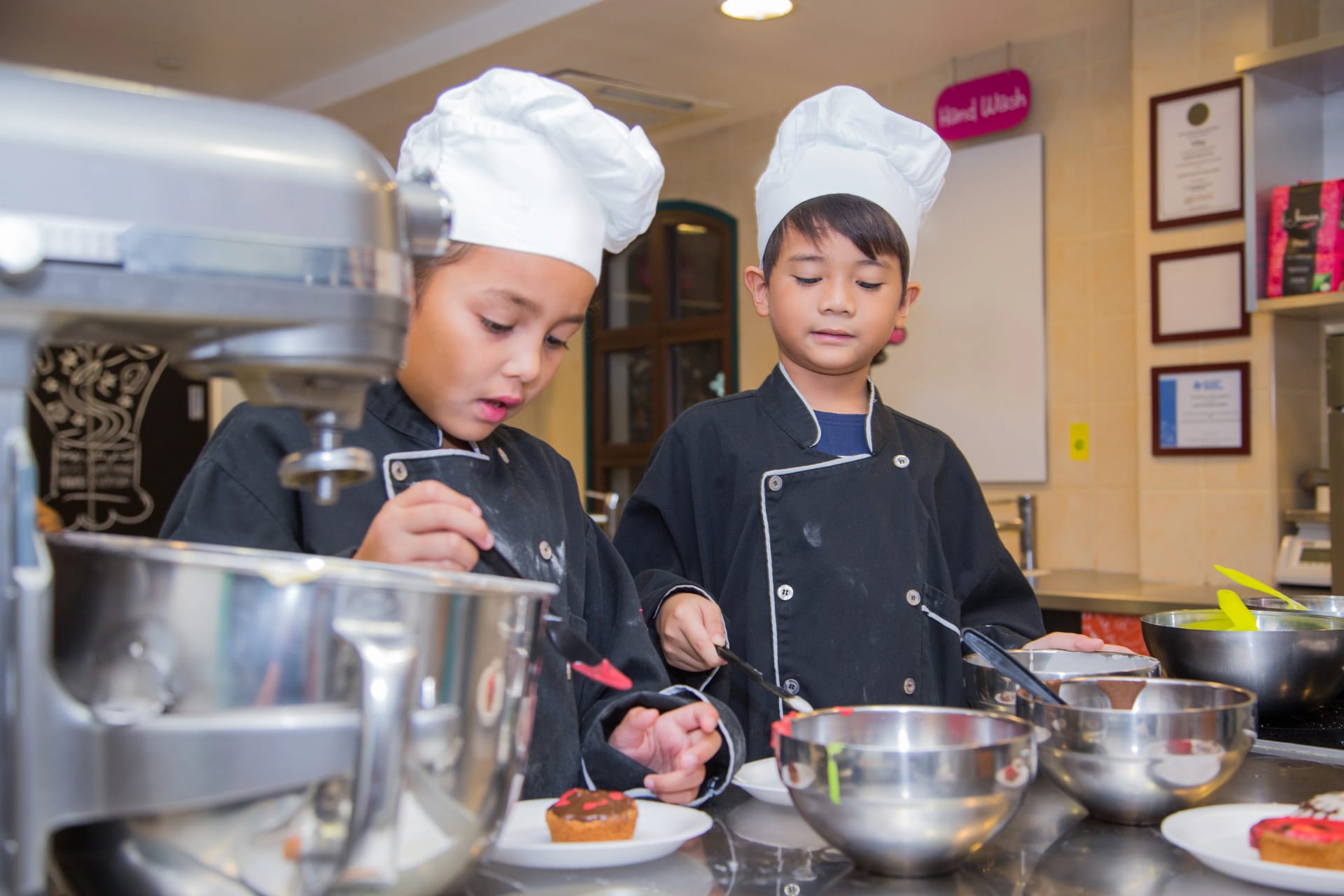 Kids exploring KidZania Dubai interactive careers