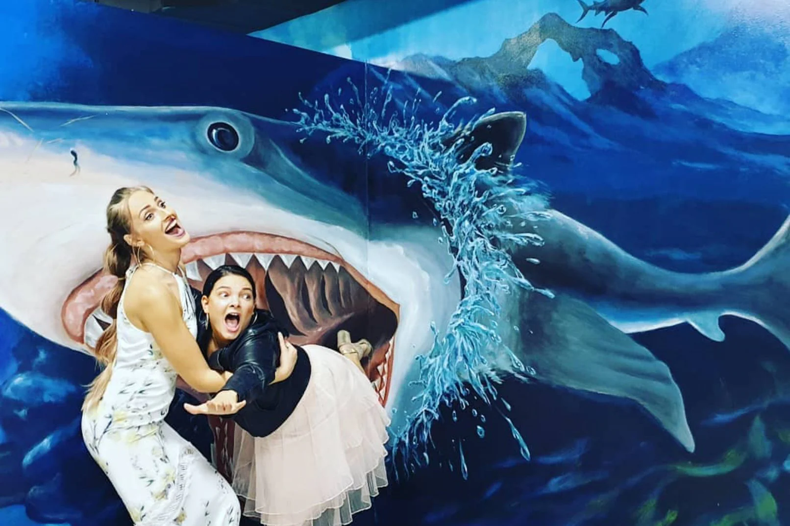 Woman interacting with 3D art in Dubai museum