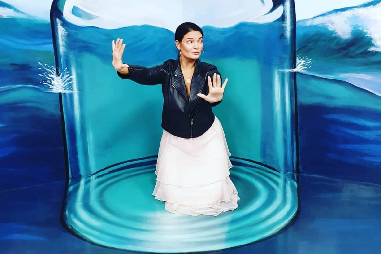 Woman interacting with 3D art in Dubai museum