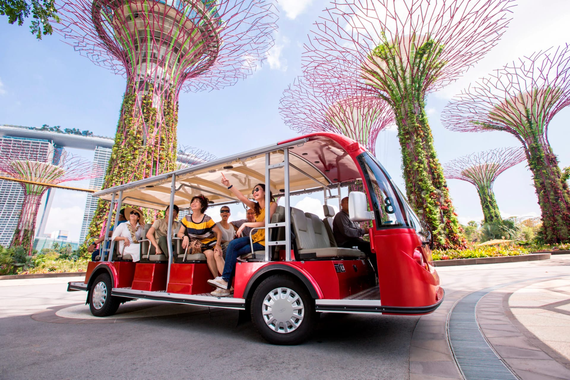 Visitors enjoying Gardens by the Bay audio tram tour in Singapore