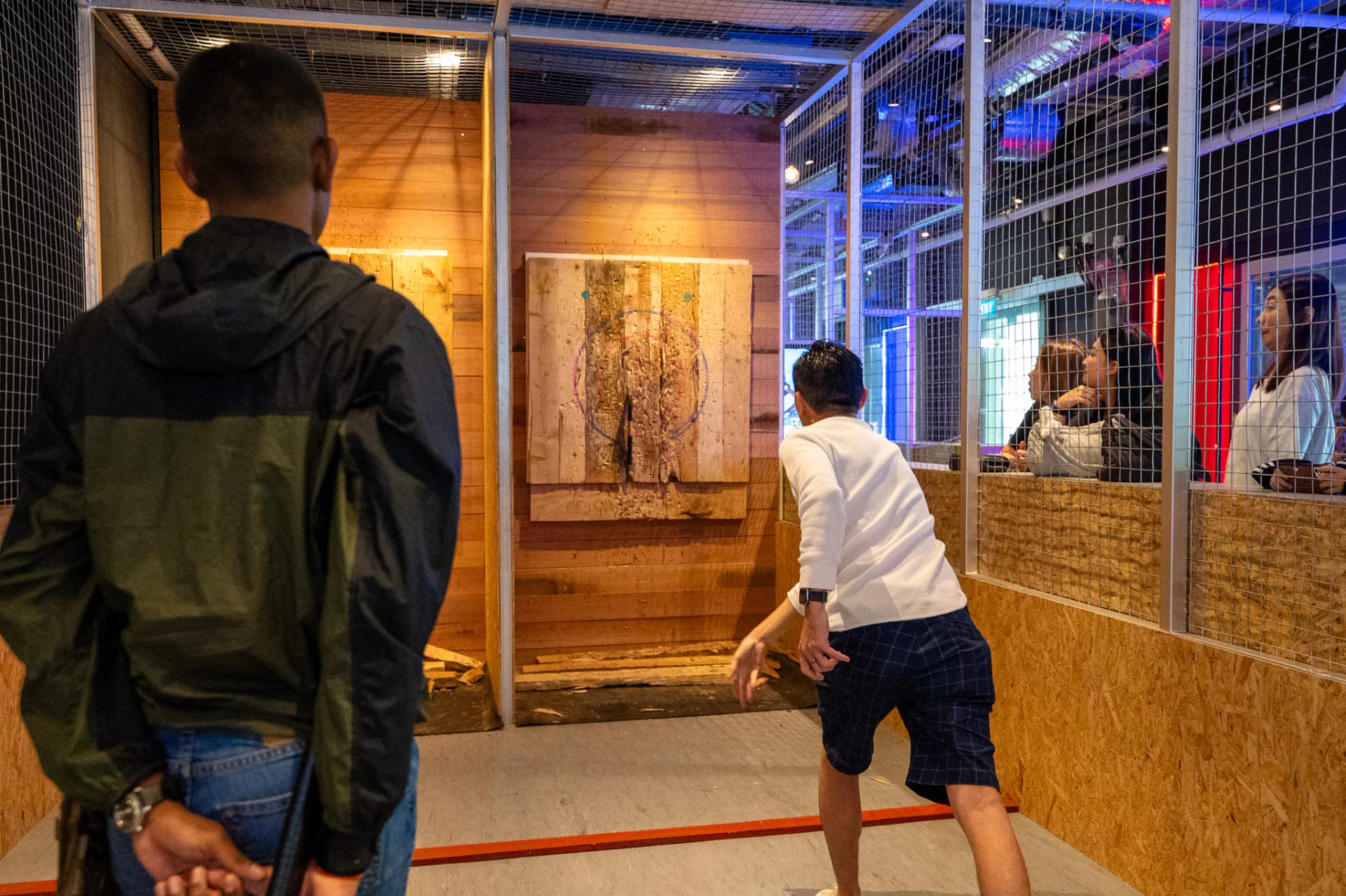 Participants enjoying axe throwing in Singapore