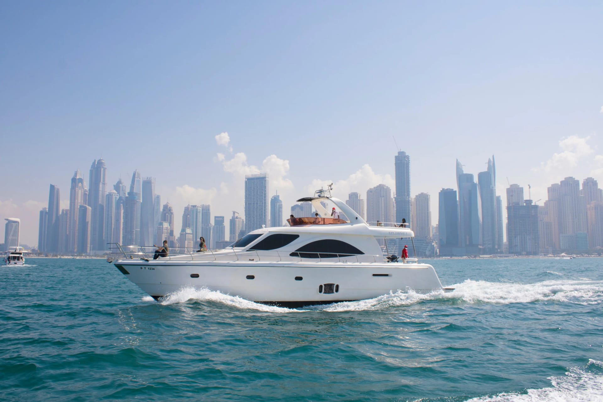 Luxury yacht sailing in Dubai's stunning skyline