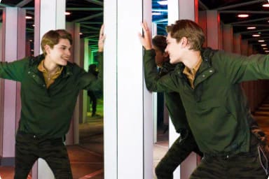 Visitor exploring the Mirror Maze at American Dream, NJ