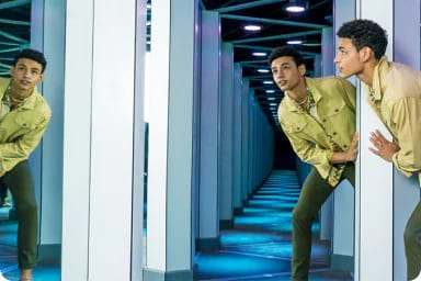 Visitor exploring Mirror Maze at American Dream, New Jersey