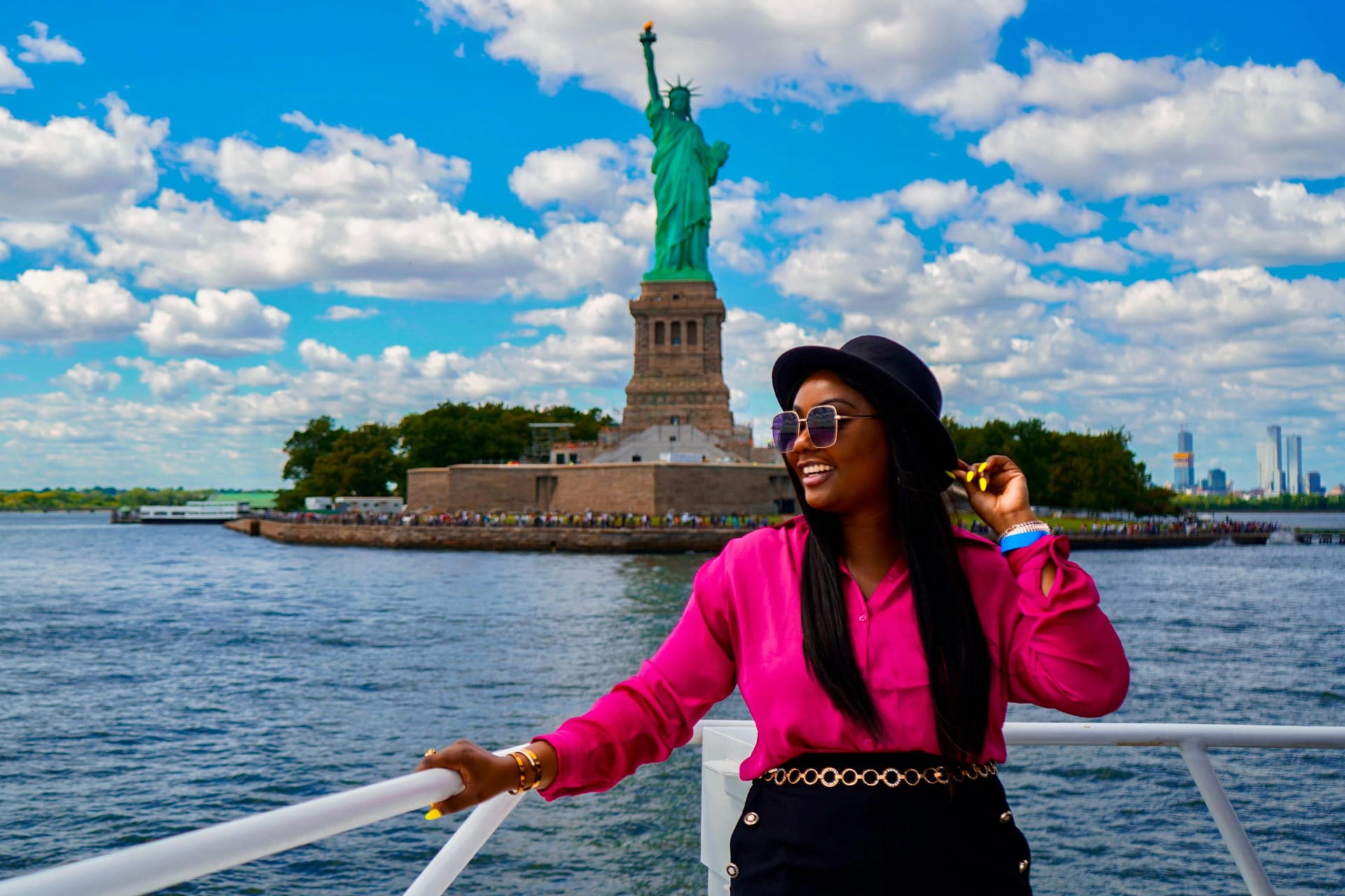 Woman enjoying Starship NYC Cruise with Statue of Liberty