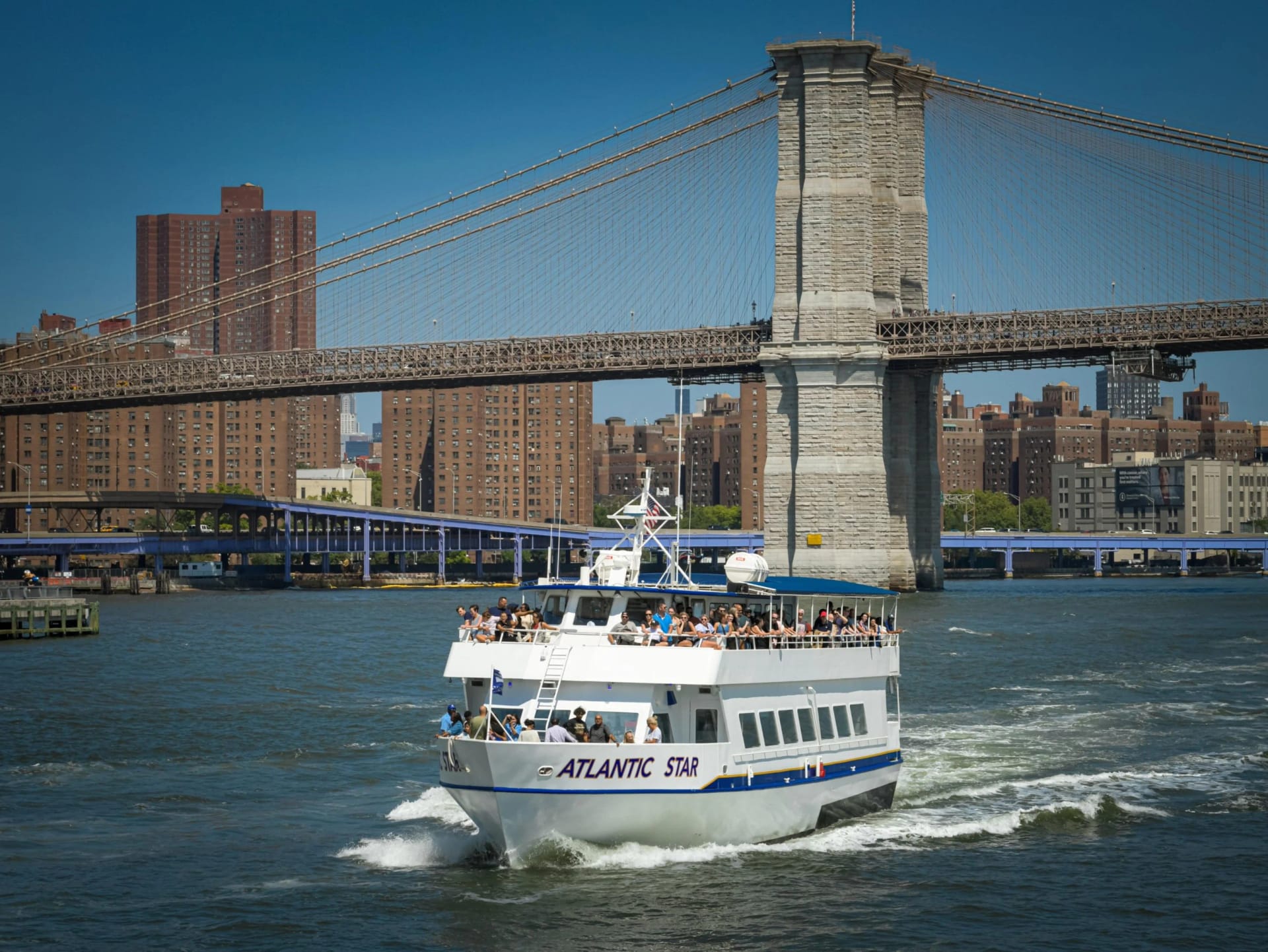 Visitors enjoying Starship NYC sightseeing cruise views