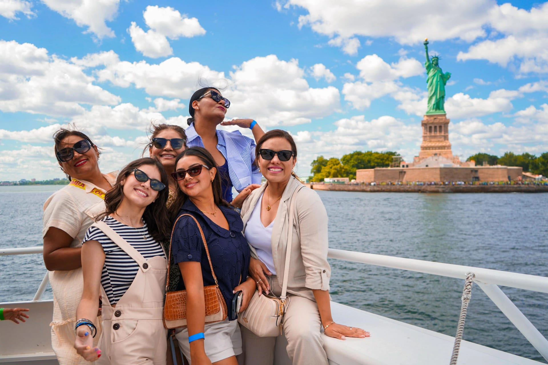 Group enjoying Starship NYC cruise with Statue of Liberty view