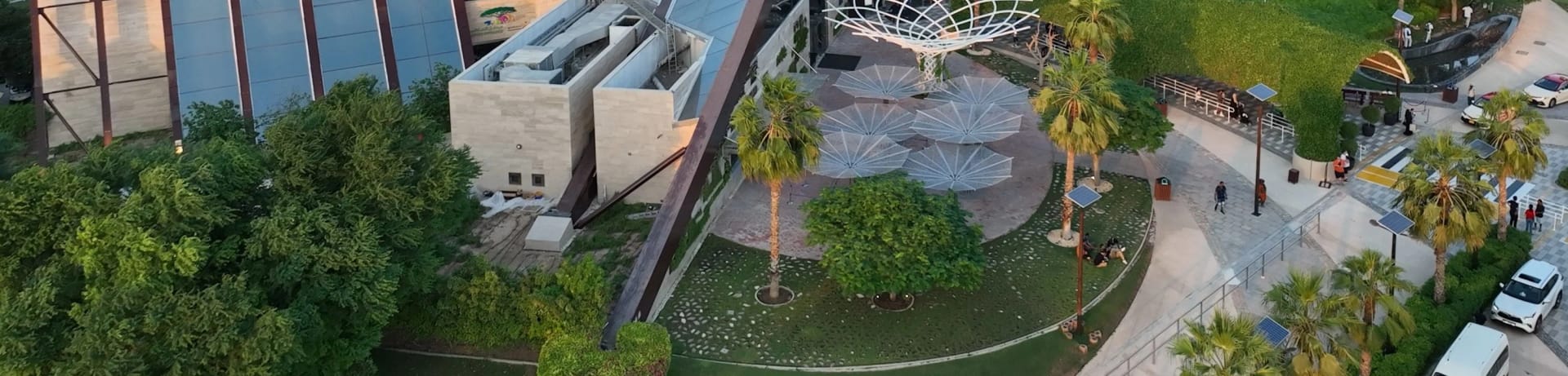 Dubai Safari Park entrance with lush greenery