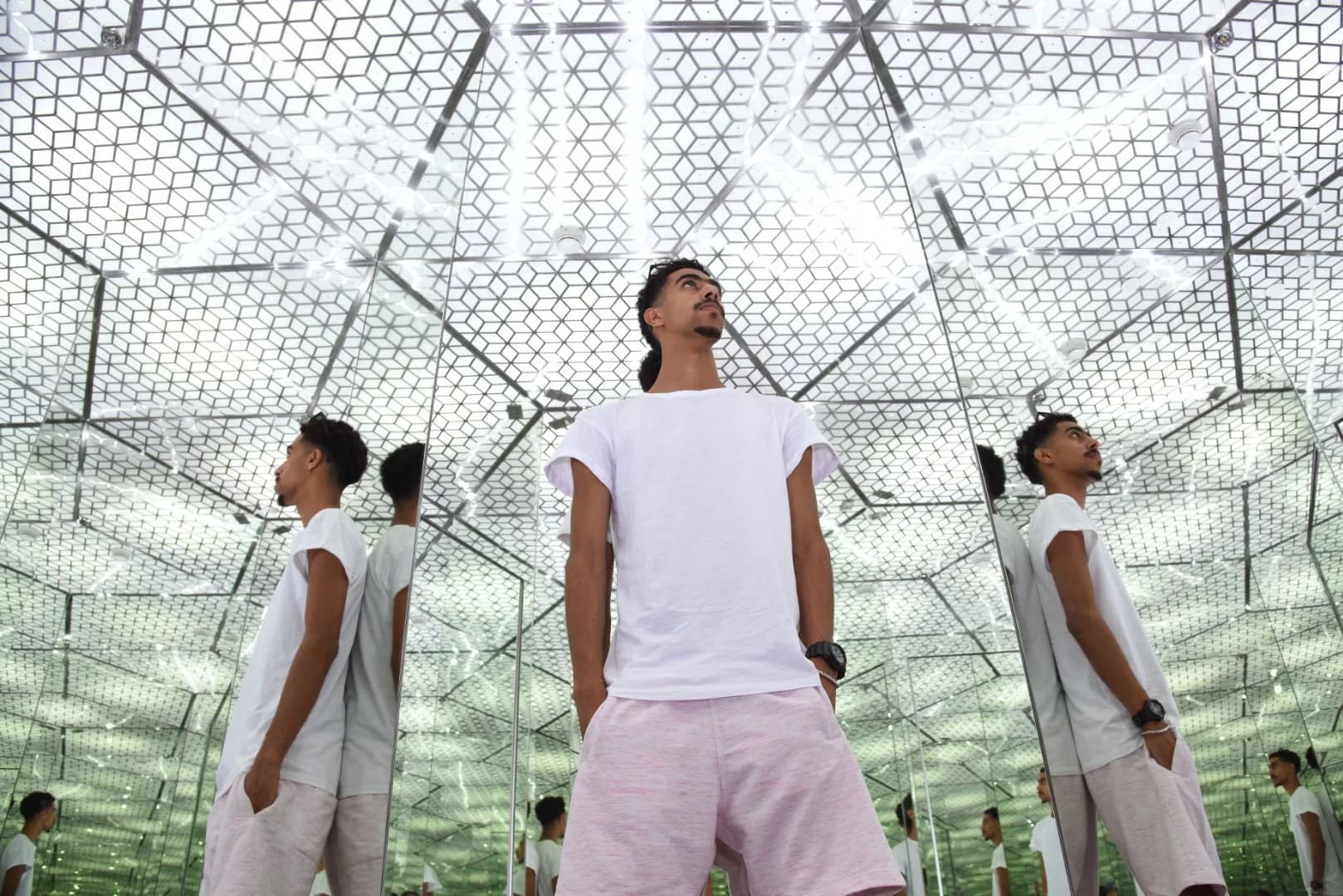 Visitor experiencing optical illusions at Museum of Illusions in Dubai
