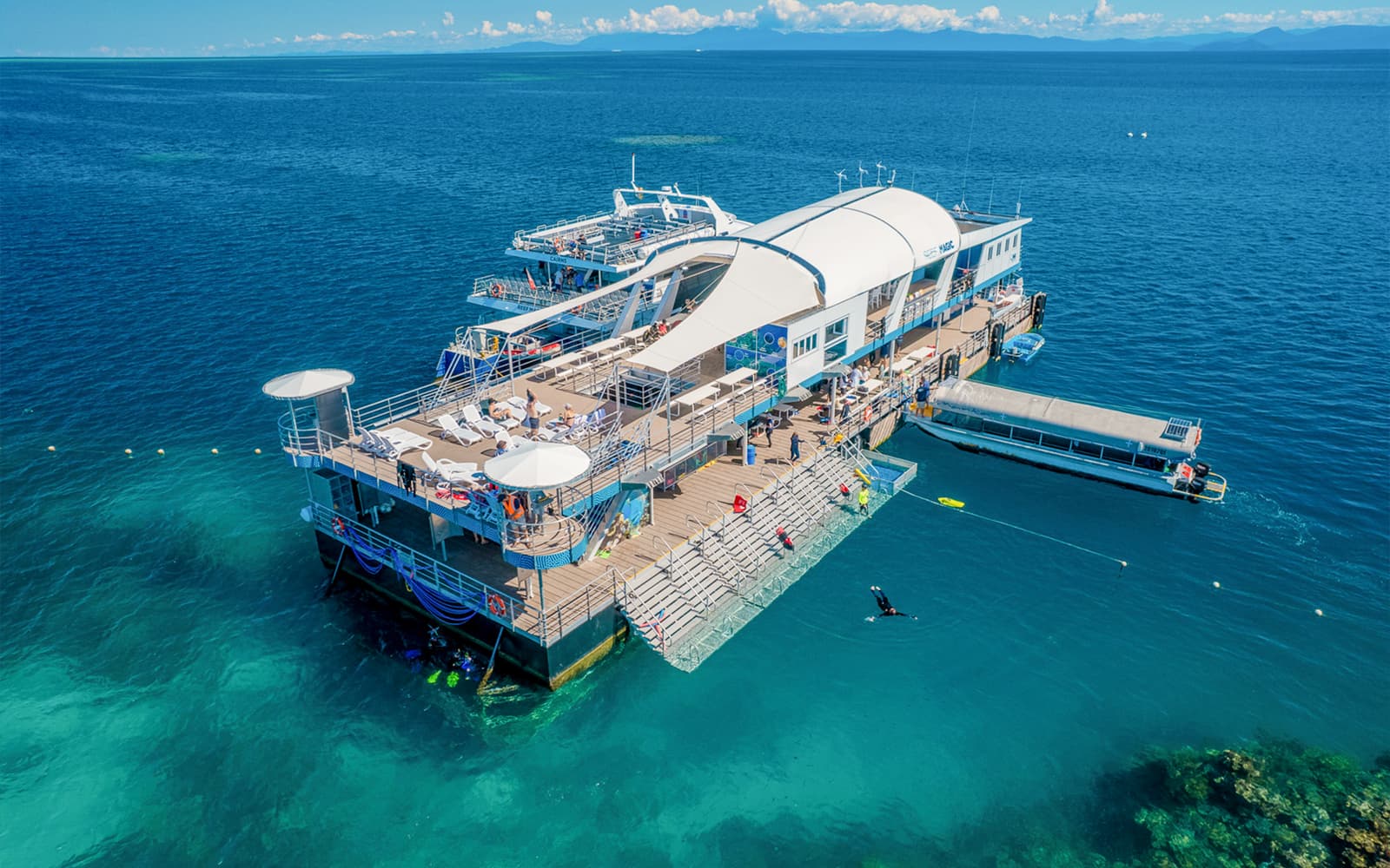 Cairns to Great Barrier Reef Snorkel Cruise with Pontoon Activities and Lunch by Reef Magic