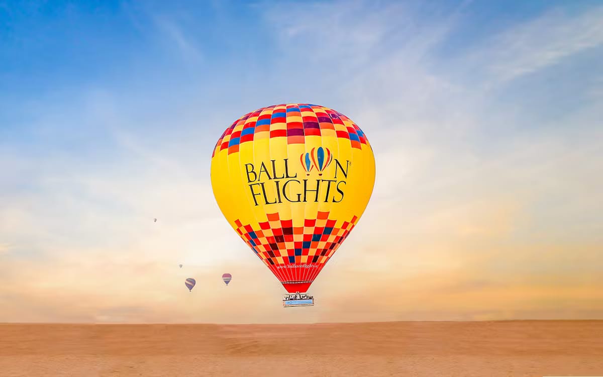 ba683fe3048b204e48fda46e060180a2-21022--dubai---sunrise-hot-air-balloon-experience-with-falcon-photography---camel-ride-10.avif