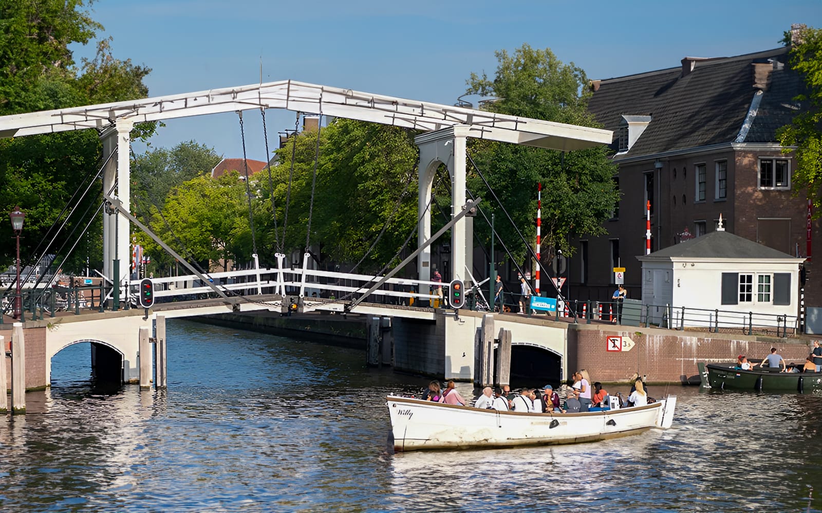 Amsterdam: 75-Minute Small Open Boat Canal Cruise tickets in Amsterdam - Activities | TickYourList