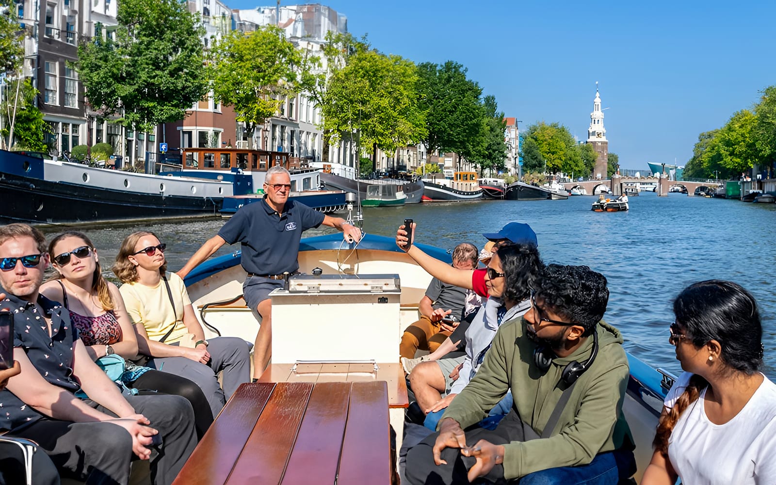 Amsterdam: 75-Minute Small Open Boat Canal Cruise tickets in Amsterdam - Highlights | TickYourList