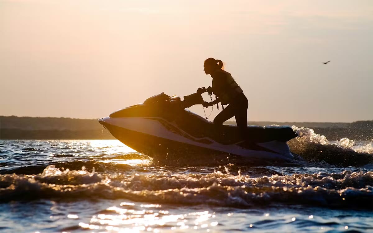 fbc202738da10833f0f7b2fd6b764da8-Womanridingajetskiagainstthesunset.avif