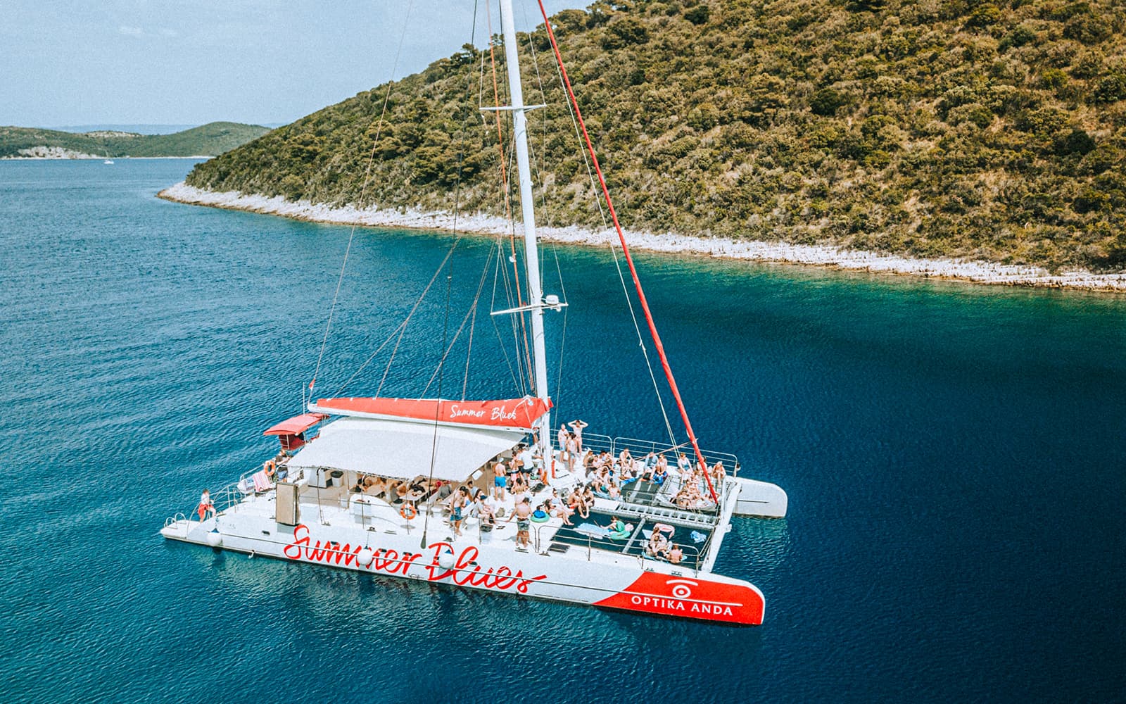 From Split: Full-Day Catamaran Cruise to Hvar & Pakleni Islands with Unlimited Drinks & Meals