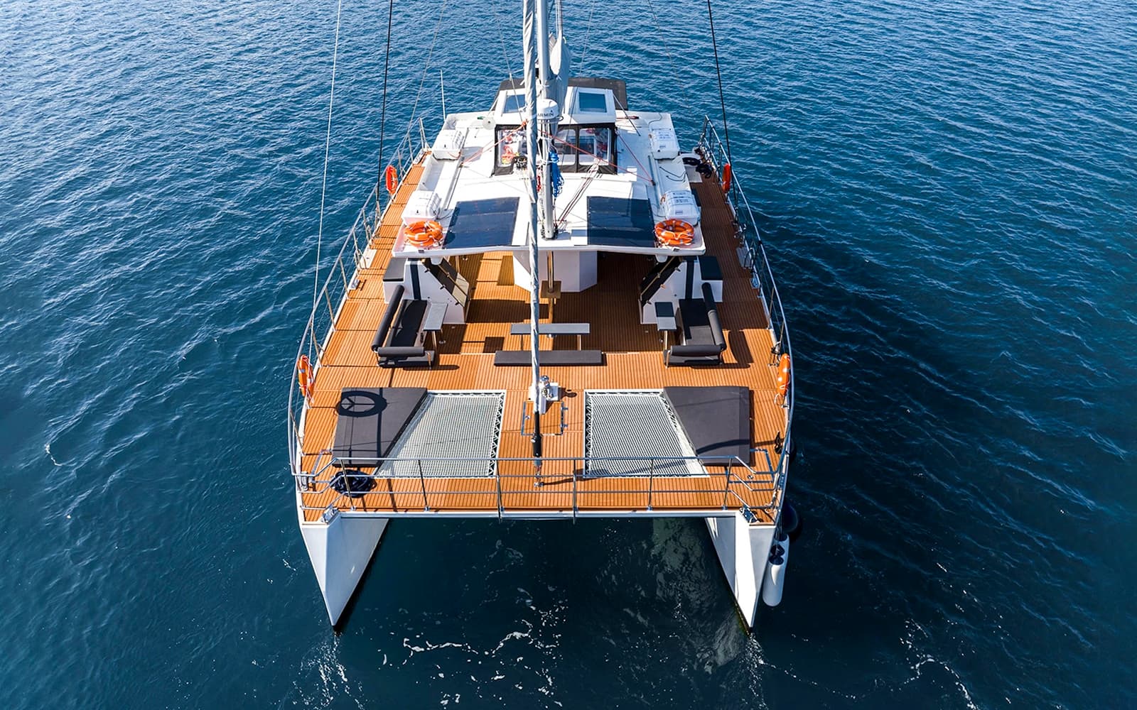 From Santorini: Classic Catamaran Cruise with Meal, Drinks & Transfers