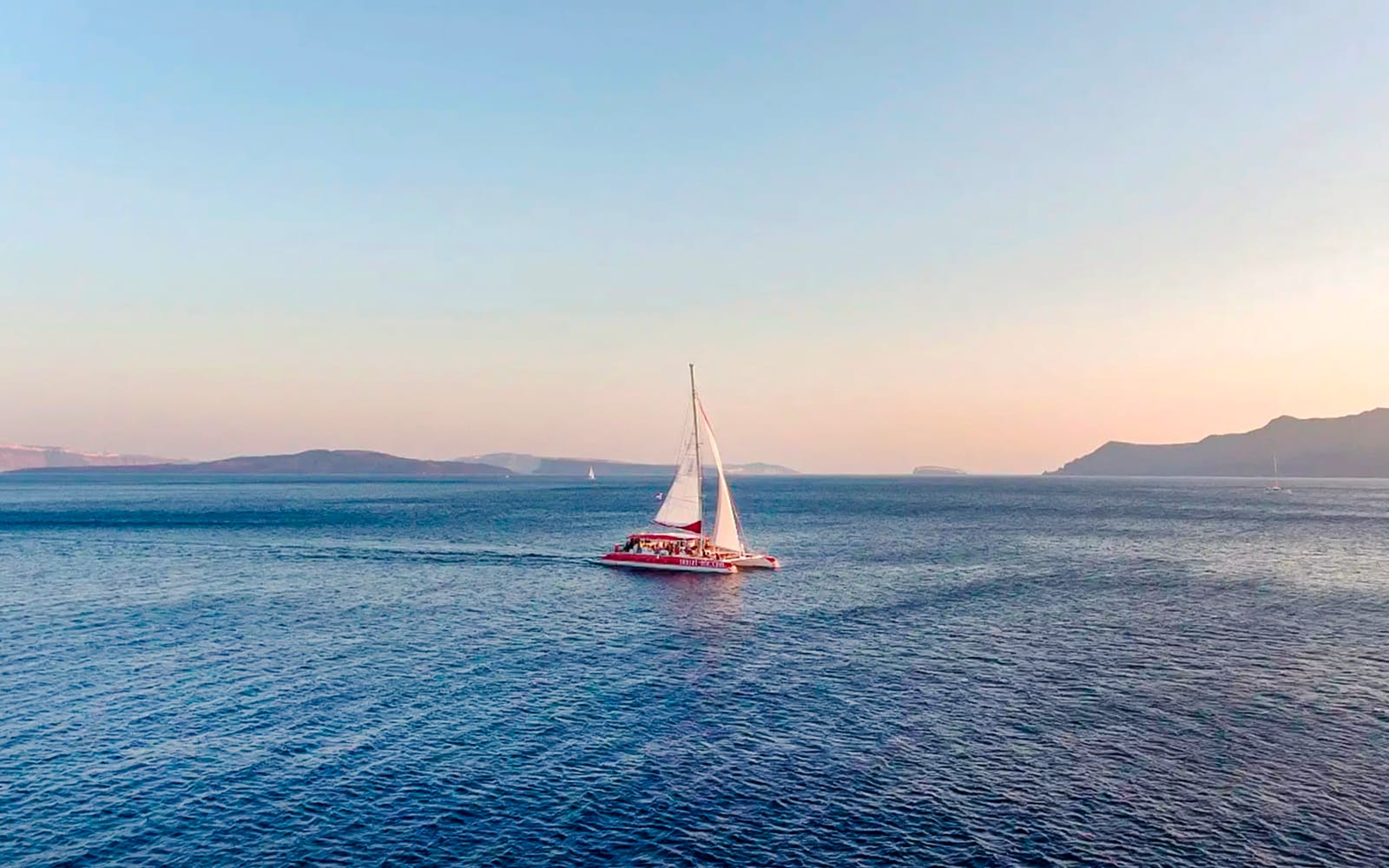 Santorini Catamaran Cruise with Greek BBQ & Drinks experience tickets in Santorini | TickYourList