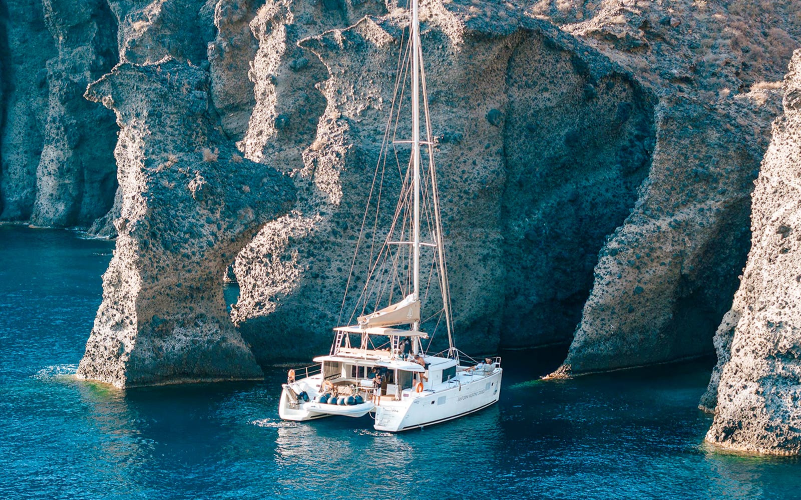 From Santorini: Luxury Catamaran Day Cruise with Lunch, Drinks & Transfers experience tickets in Santorini | TickYourList