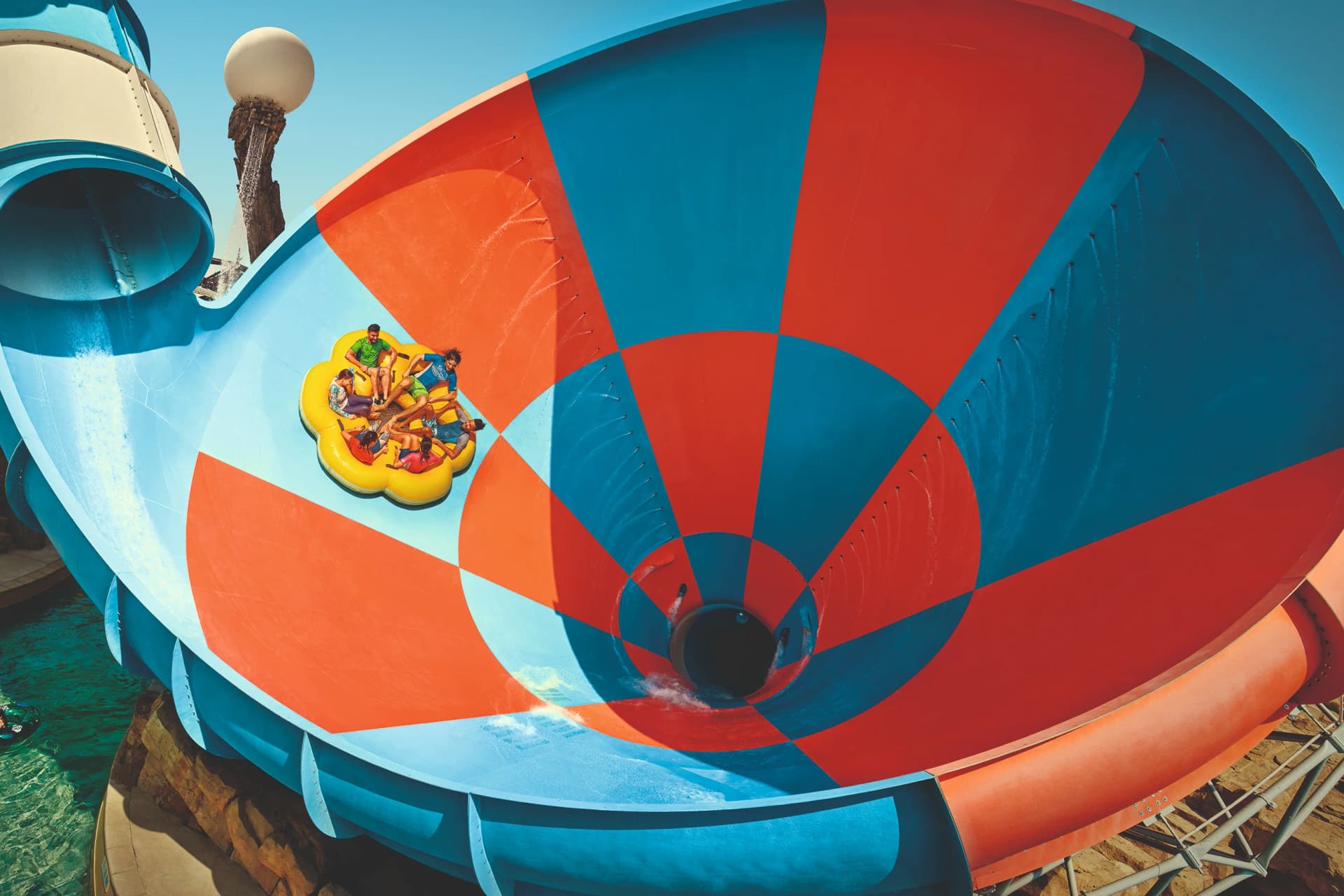 Group enjoying thrilling water slides at Yas Waterworld