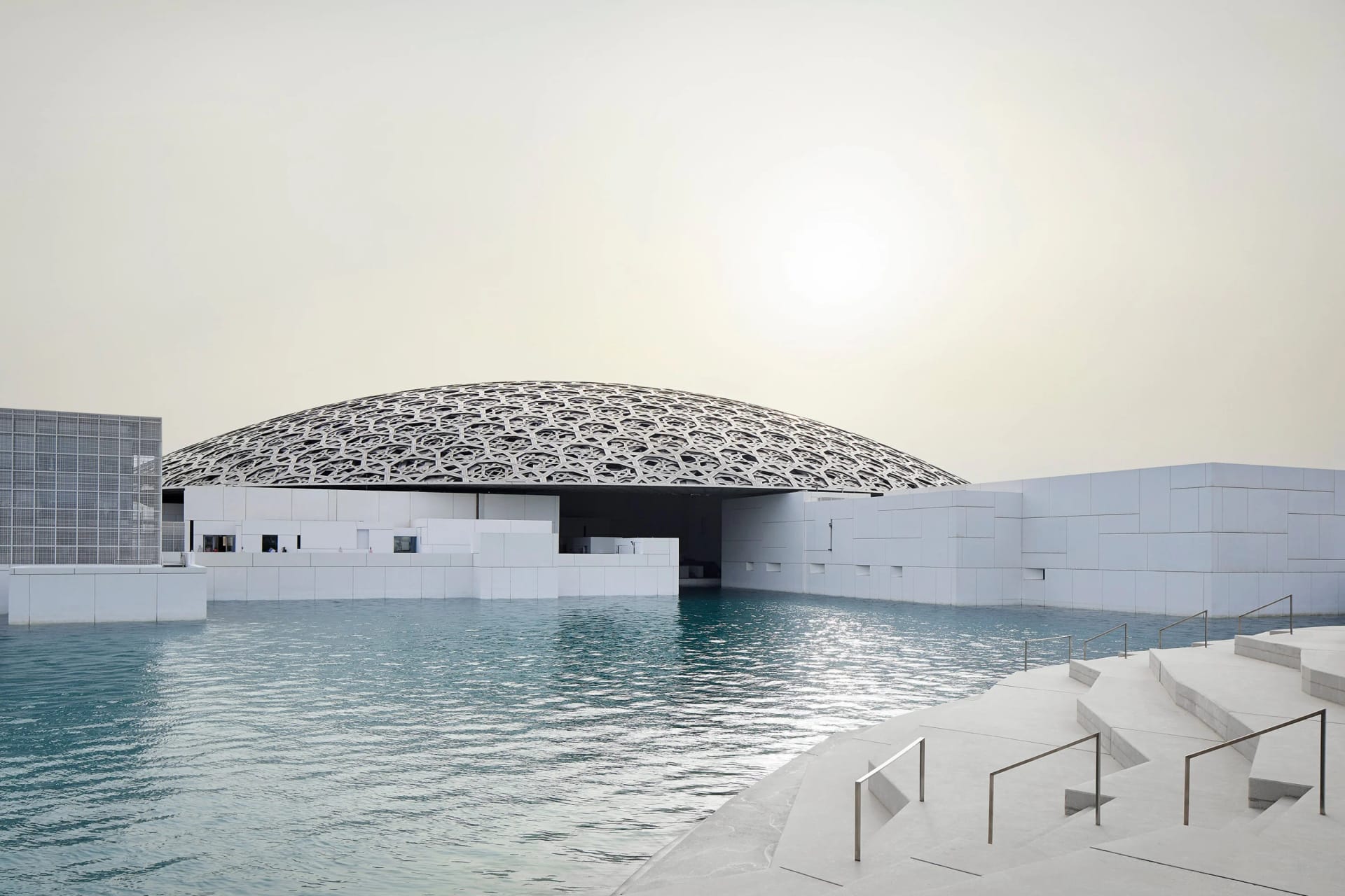Visitors exploring Louvre Abu Dhabi art museum
