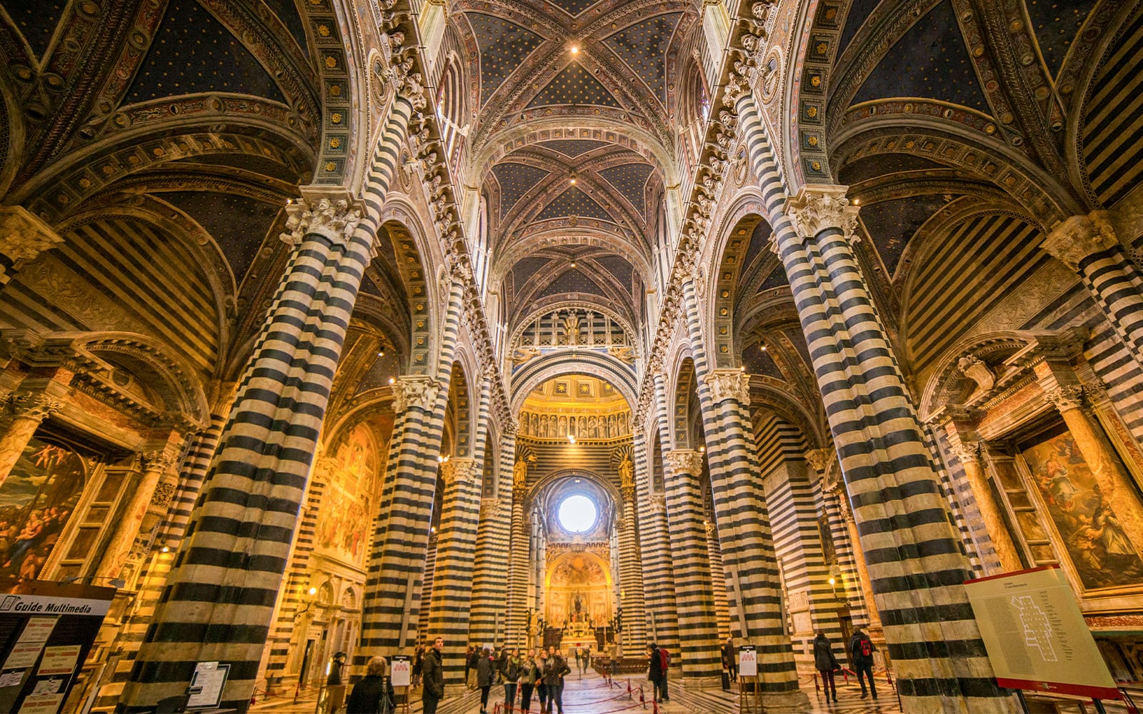 91872045f46812bdc6819a3db3422cf0-Combo-deal-with-1--savings--Tourists-exploring-the-stunning-Siena-Cathedral-and-San-Gimignano-Museum-in-Italy.jpg